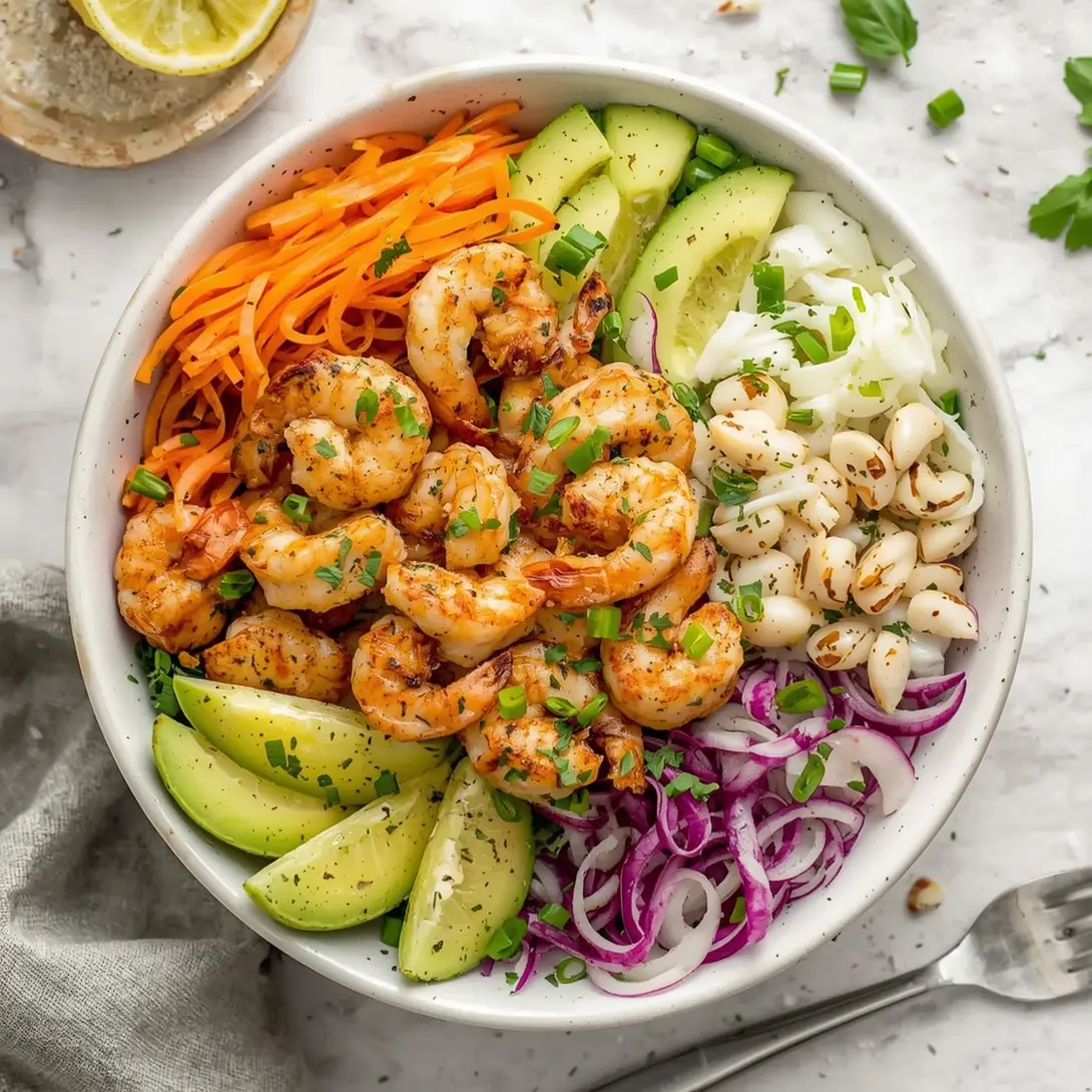 A colorful buddha bowl with grilled shrimp, brown rice, and fresh vegetables.