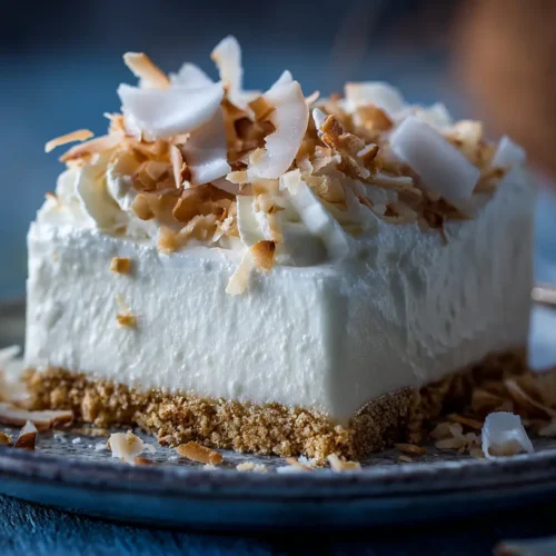 A light and airy Coconut Cream Lush dessert in a clear dish
