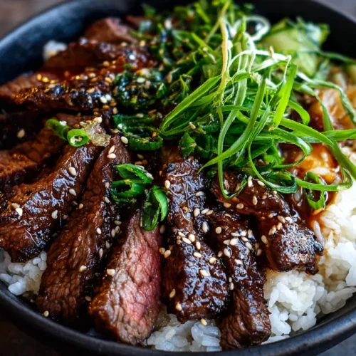 A full bowl of hibachi steak, vegetables, and rice.