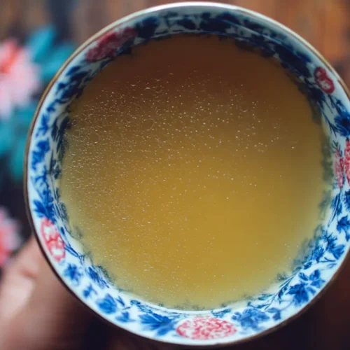 A steaming mug of nourishing bone broth, rich in nutrients.