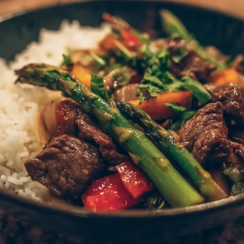 A vibrant beef stir fry with colorful vegetables in a wok