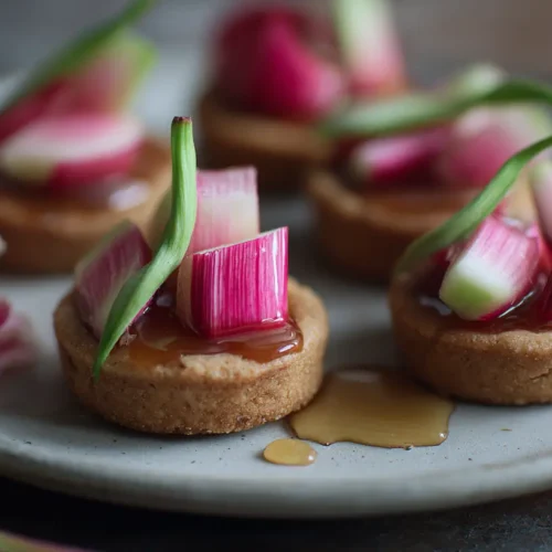 A plate of freshly baked rhubarb cookies with a delicate pink hue.