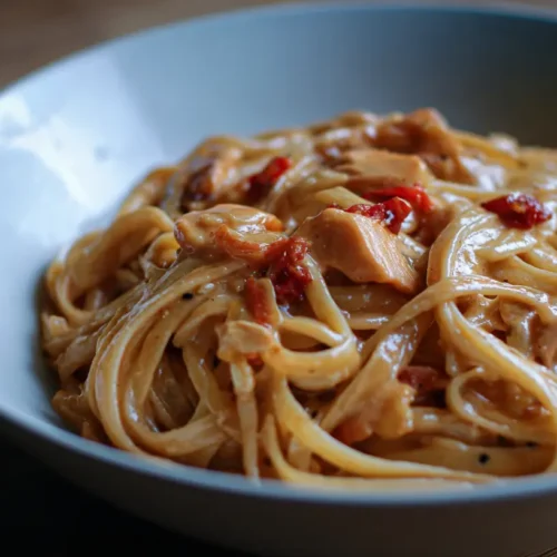 A steaming bowl of one pot pasta with fresh herbs