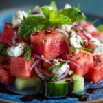 A vibrant watermelon feta salad with fresh mint and balsamic glaze.